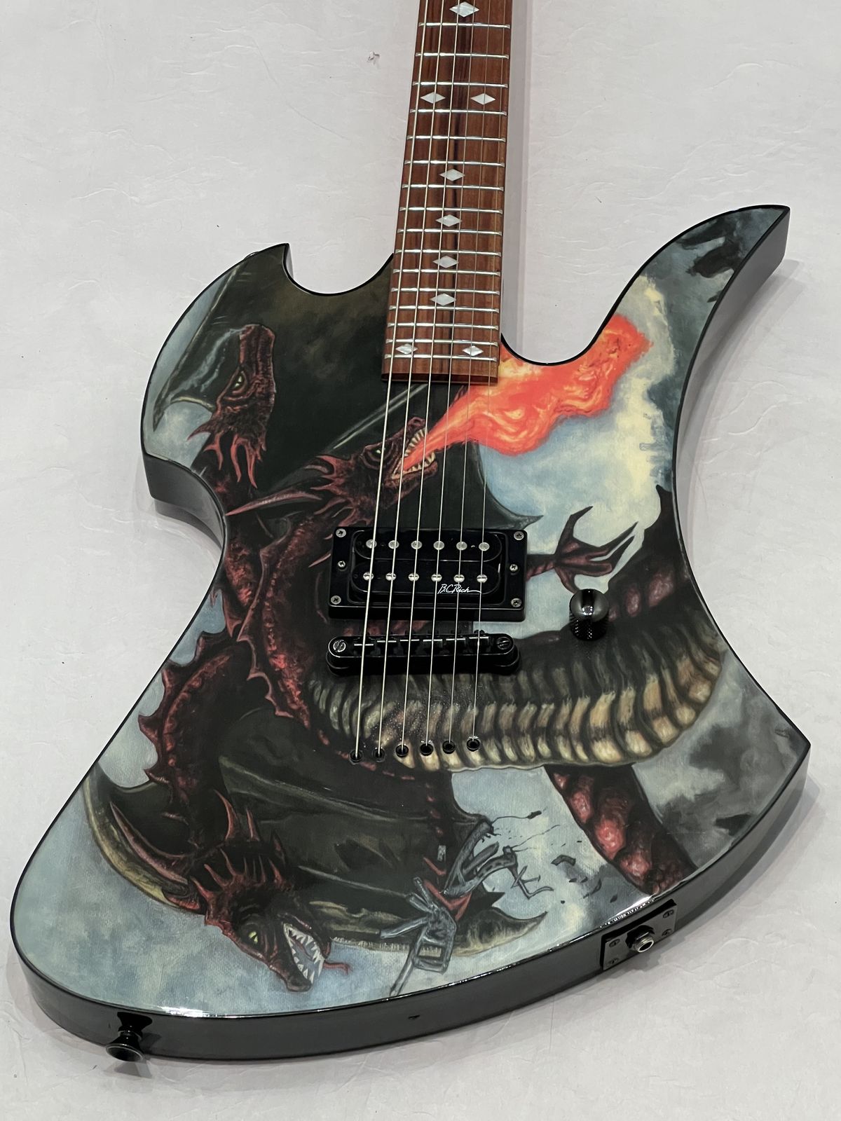B.C. Rich Mockingbird Fire Breather Body Art guitar with a dragon graphic